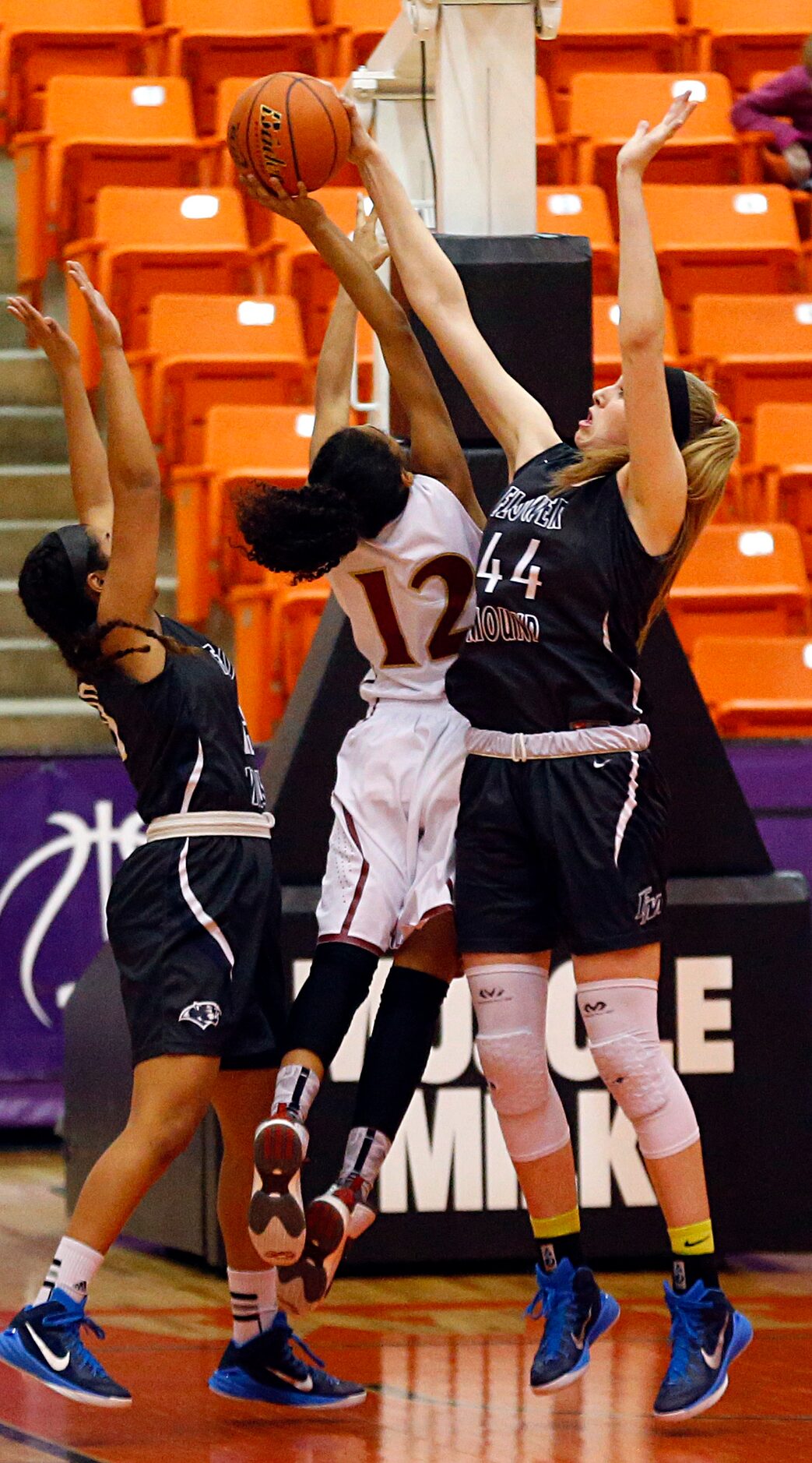 Flower Mound center Lauren Cox (44) blocks a shot put up by El Paso El Dorado guard Ebonie...