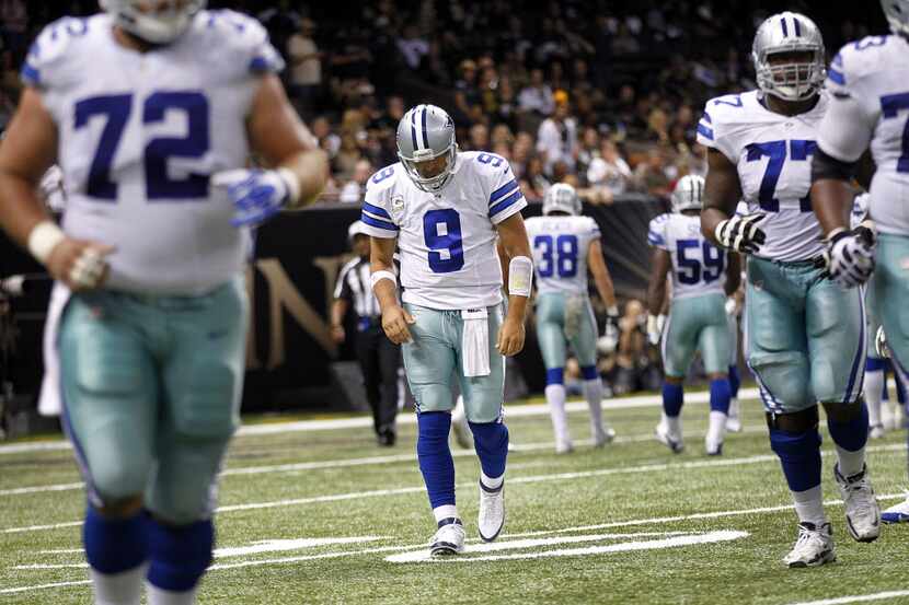 Dallas Cowboys quarterback Tony Romo (9) leaves the field after not converting on third down...