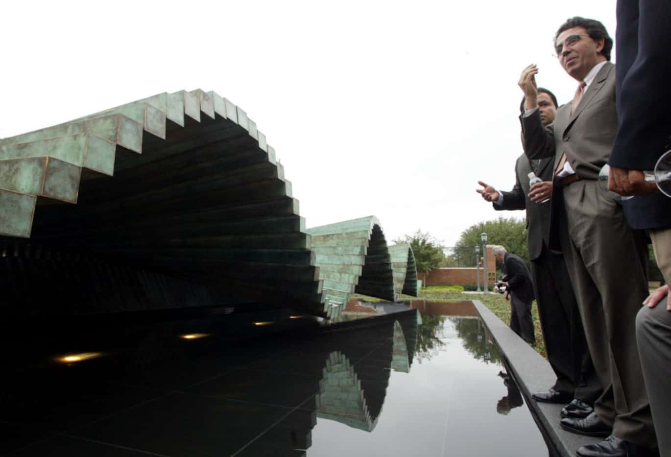 Spanish sculptor Santiago Calatrava (right, foreground, gesturing) talks with guests...