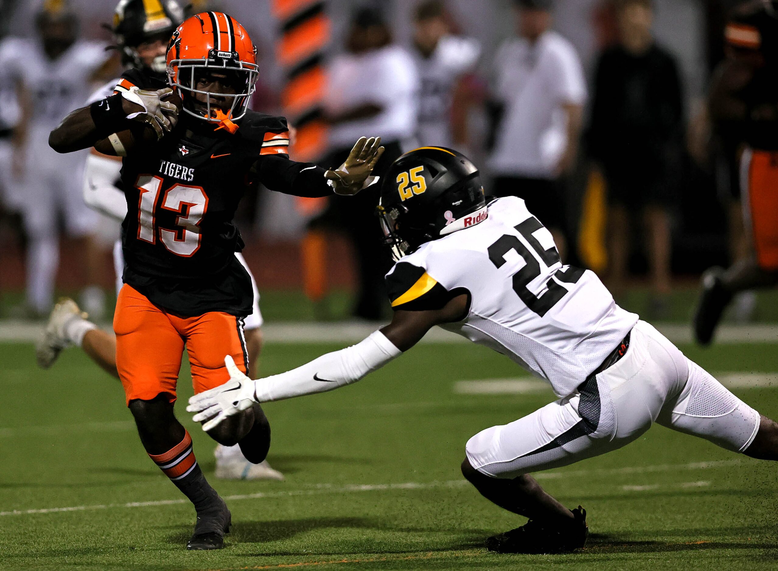 Lancaster wide receiver Maurice Sherrad (13) comes up with a reception and tries to avoid...