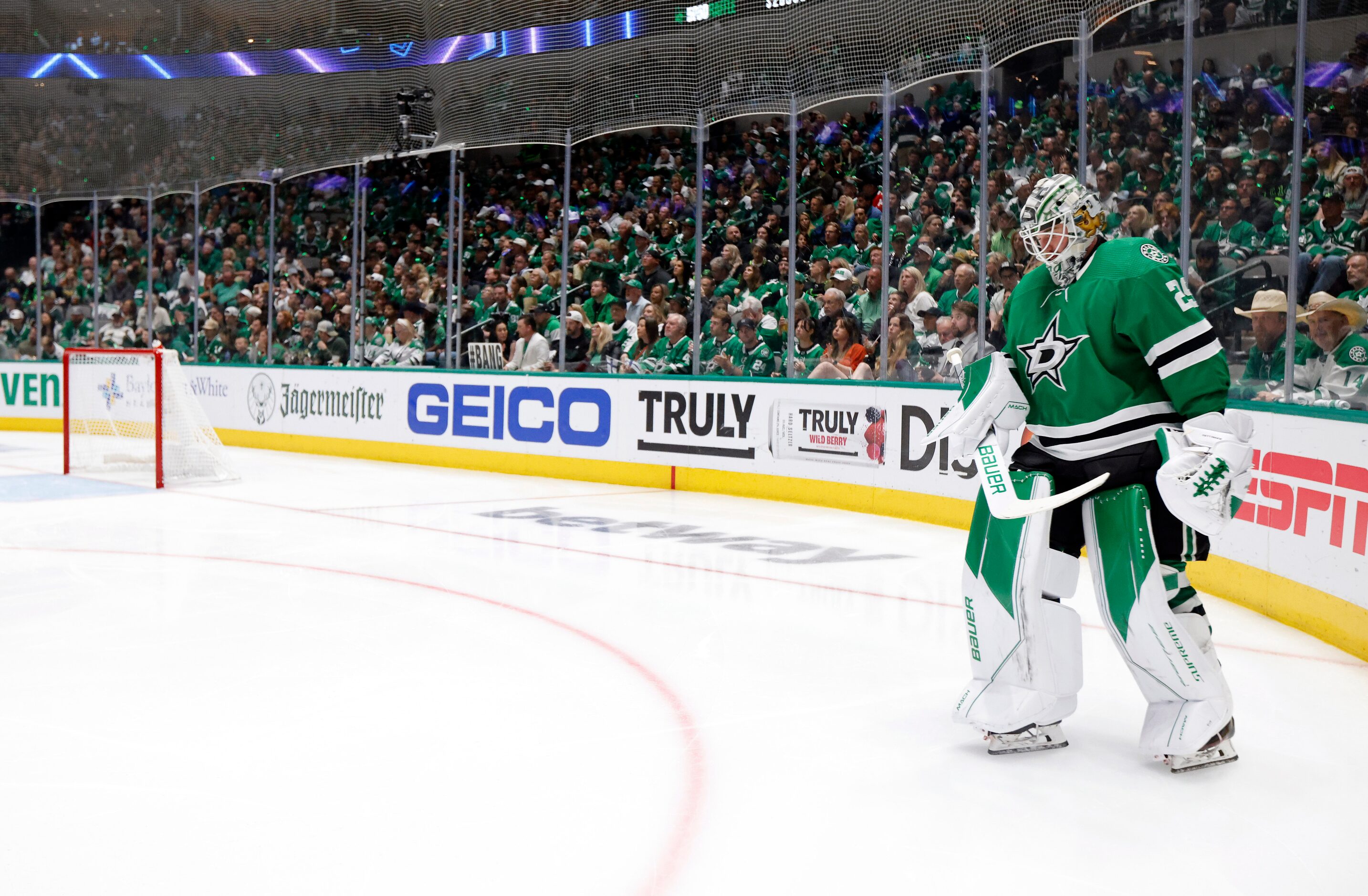 Dallas Stars goaltender Jake Oettinger (29) skates wide of the net during a break in play...