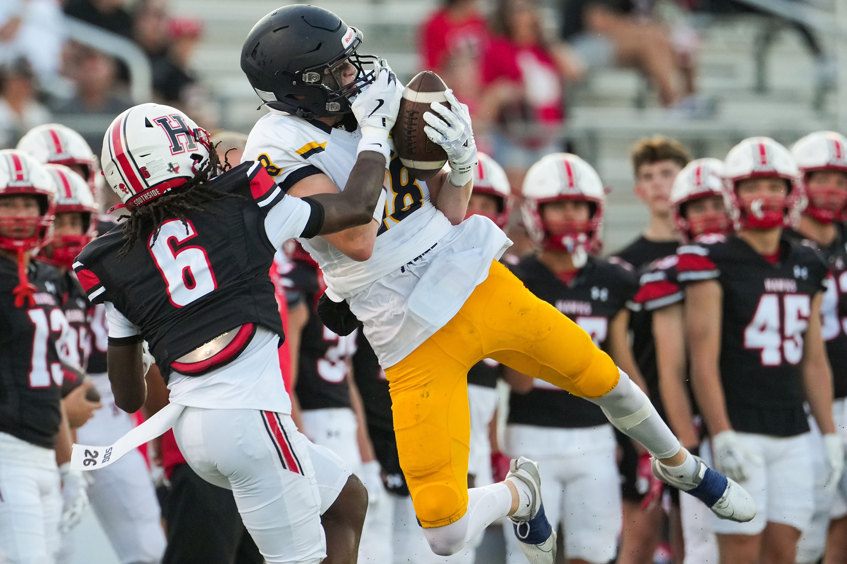 Rockwall-Heath defensive back Quincy Jones (6) breaks up a pass intended for Highland Park...