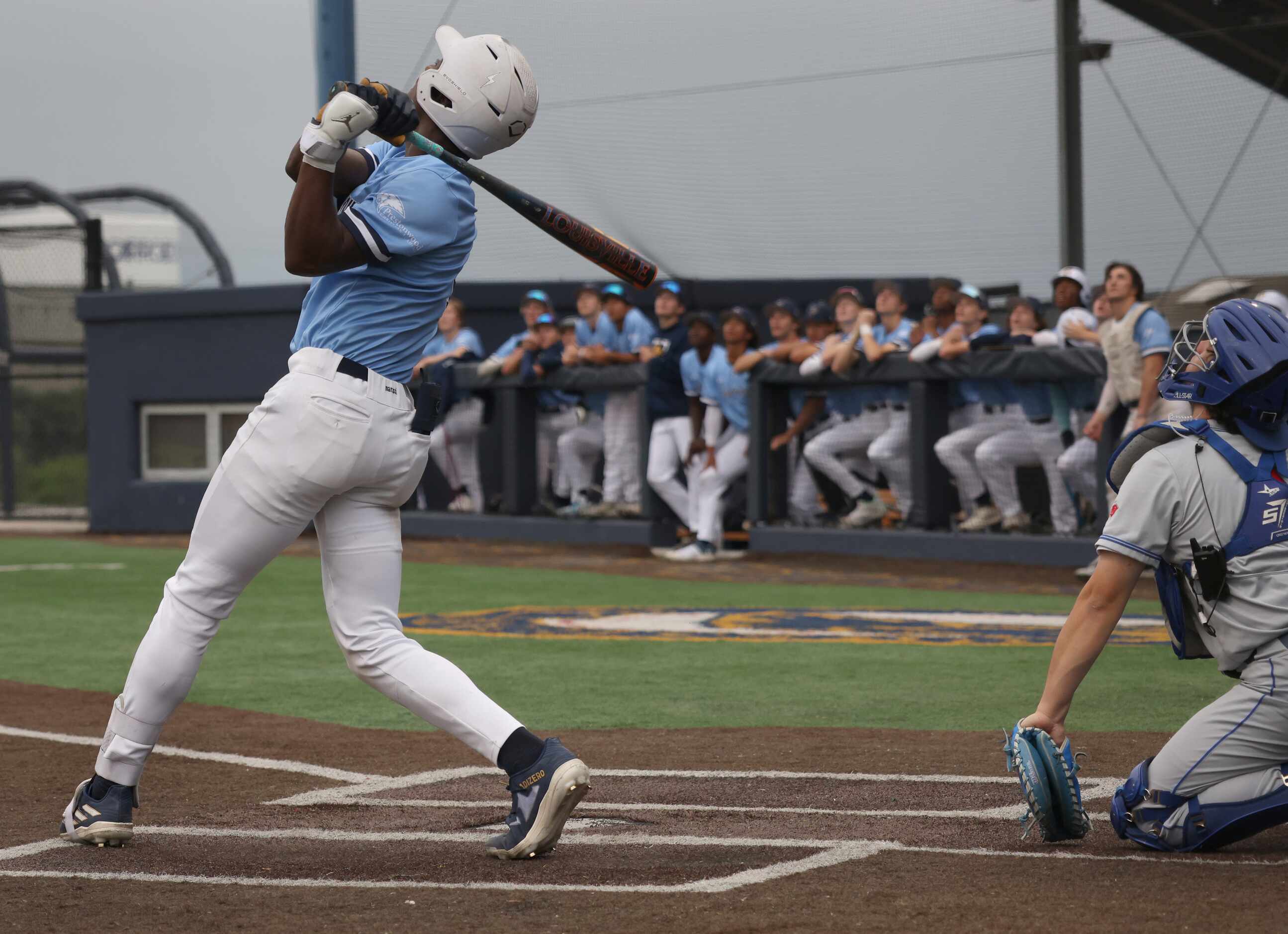 Prestonwood outfielder Lash Henderson (4) tracks a high fly ball , as do teammates in the...