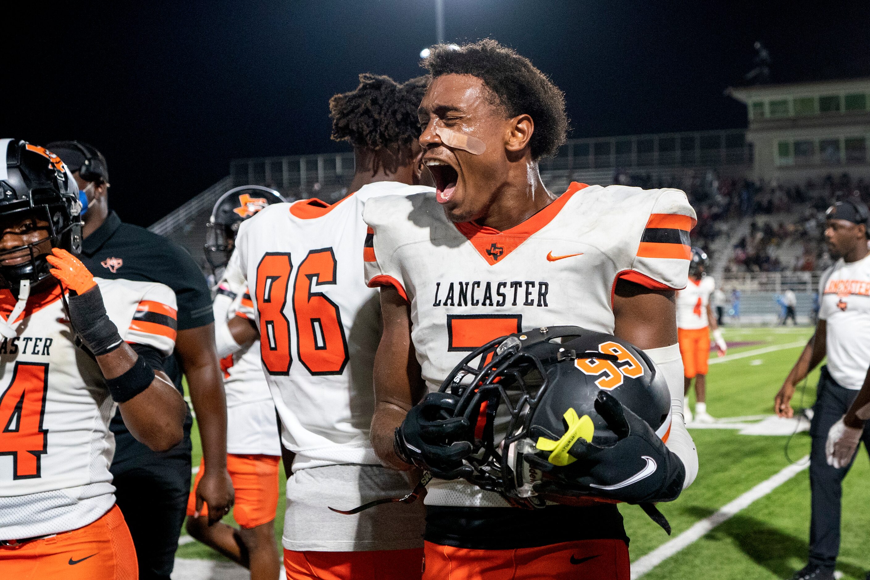 Lancaster defensive end Markeis Sykes (7) exults as the clock runs out on his team’s 16-0...