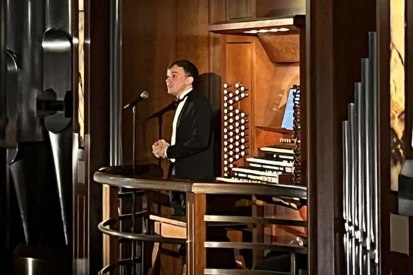 Organist Thomas Ospital talks to the audience at his Meyerson Symphony Center recital on...