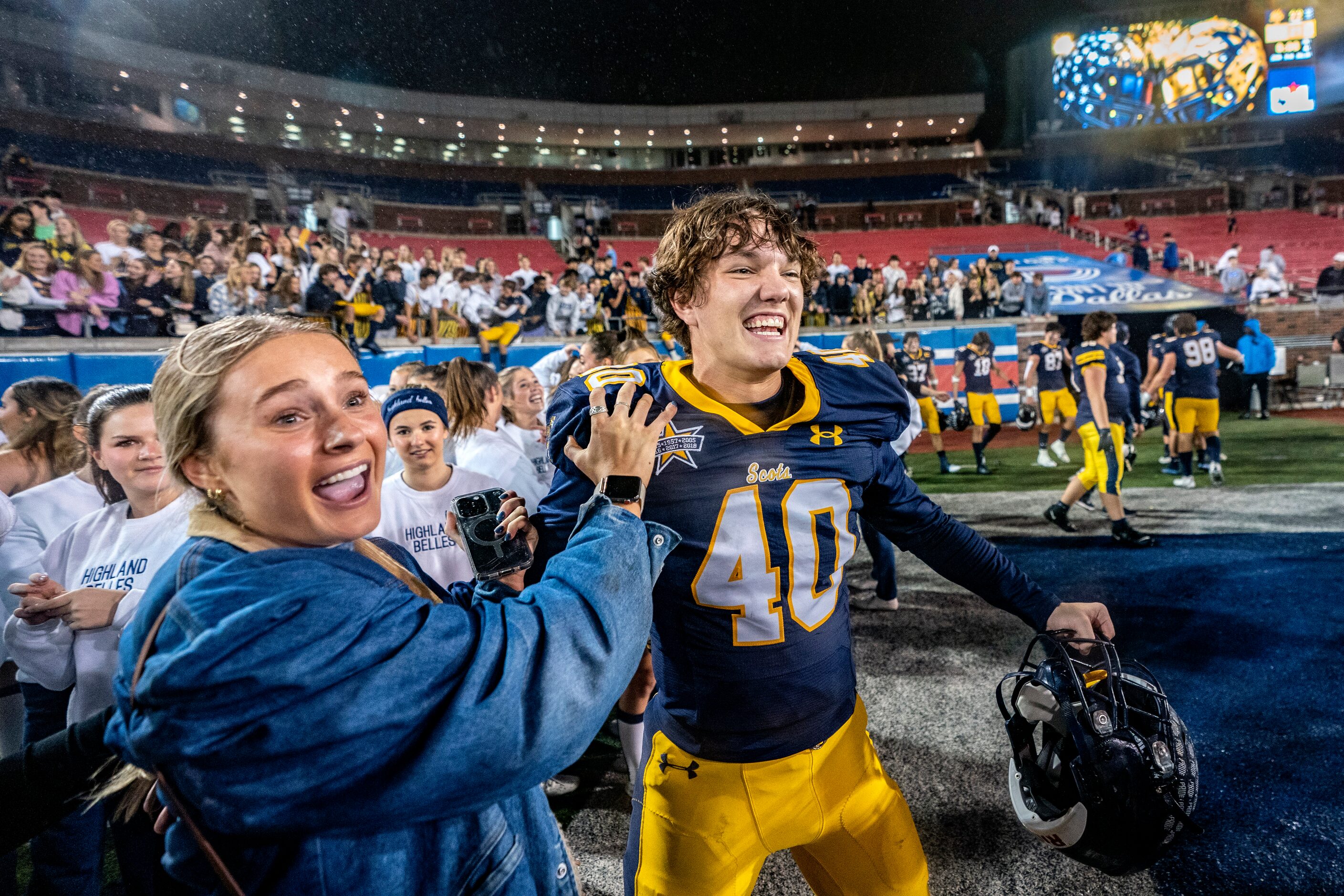 Highland Park senior kicker Nicholas Rigas (40) is congratulated by a fan after kicking a...