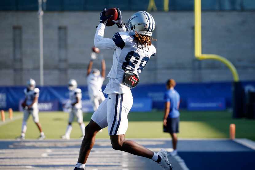 Dallas Cowboys wide receiver CeeDee Lamb (88) catches a pass in the end zone during a drill...