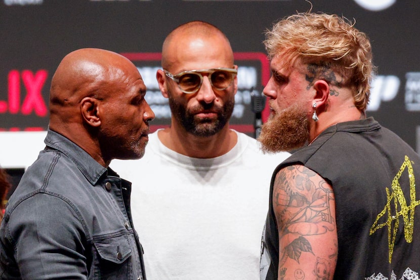 Mike Tyson faces off with Jake Paul during a news conference ahead of their boxing match at...