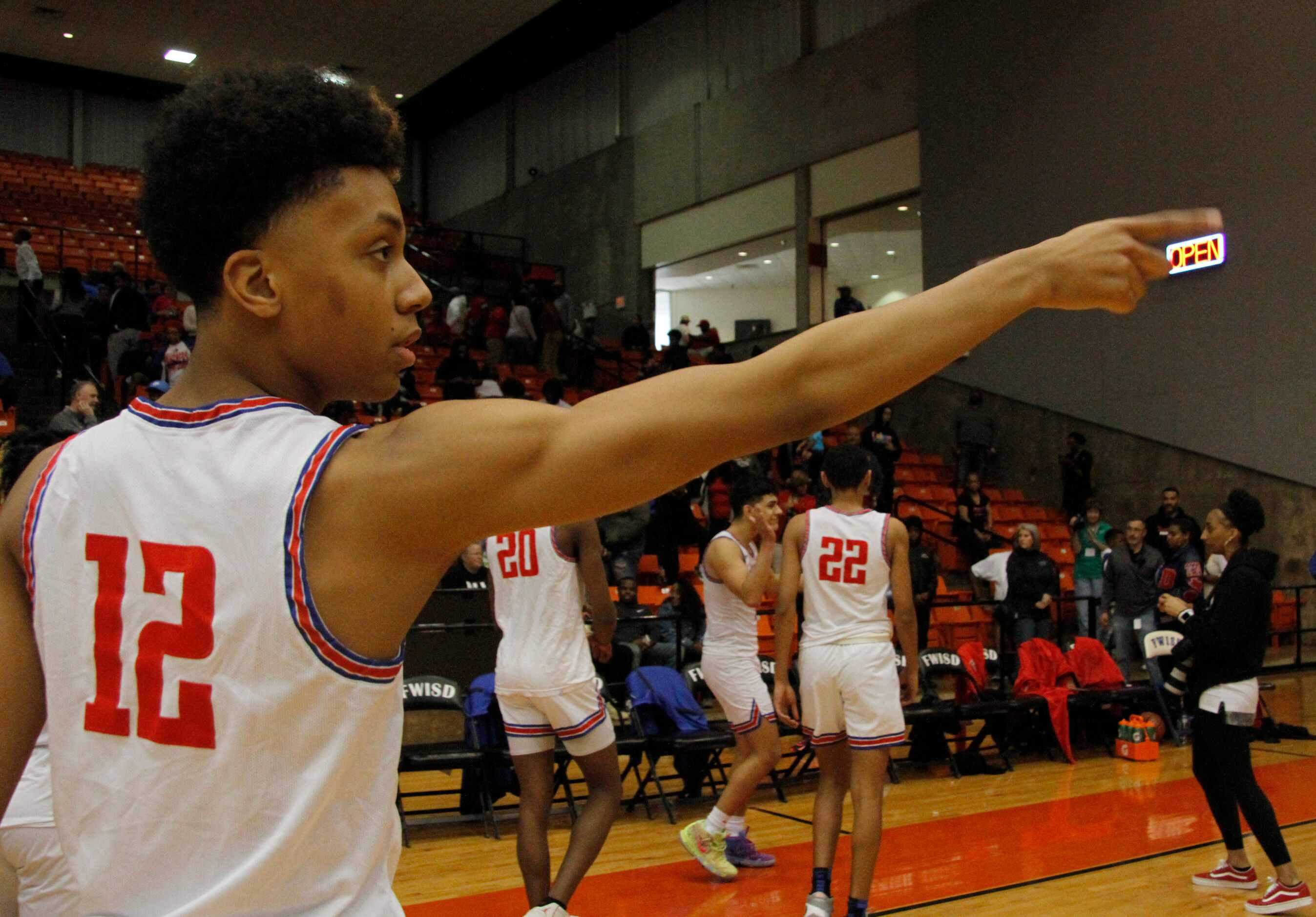 Duncanville guard Chauncy Gibson (12) acknowledges the cheers from fans following their...