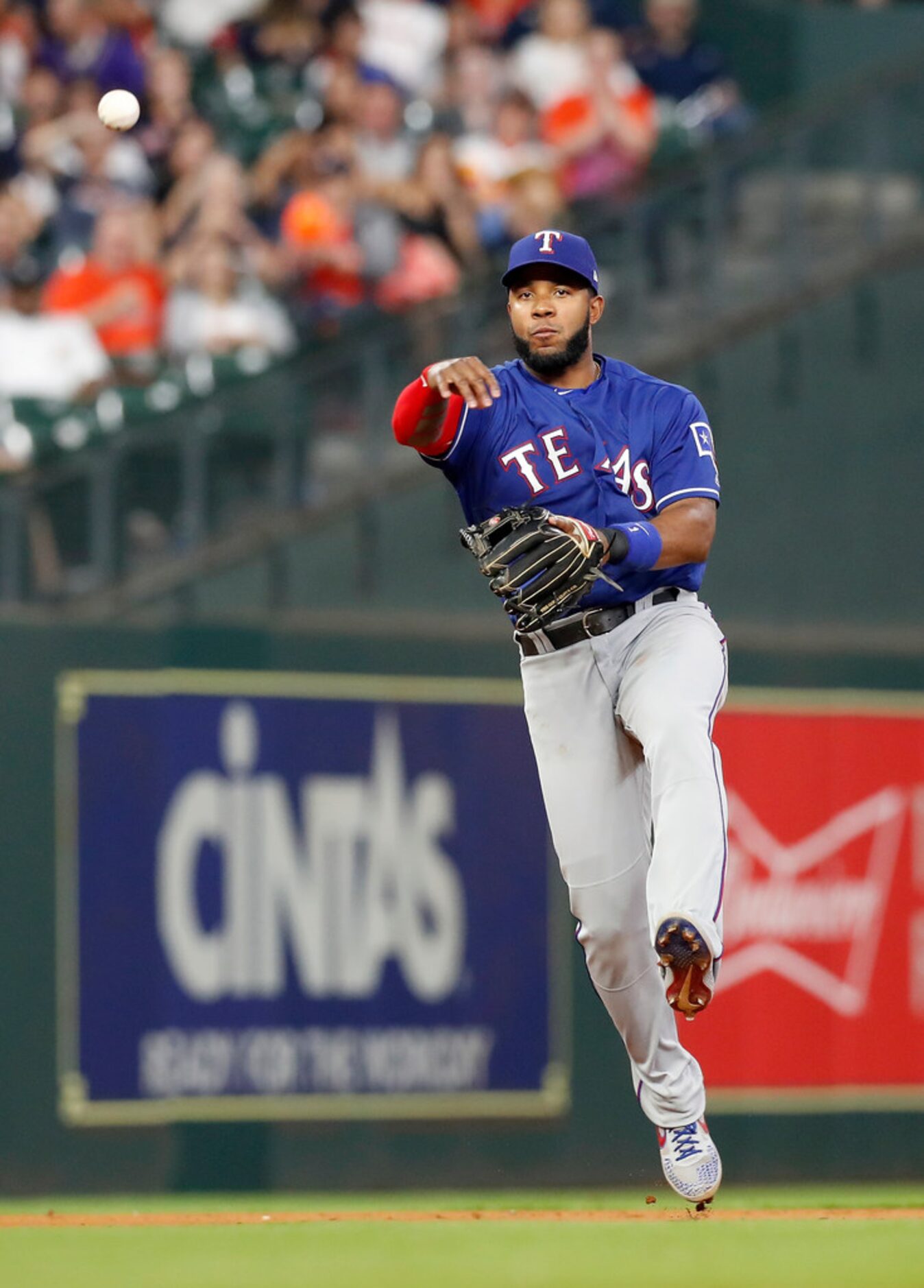 HOUSTON, TX - MAY 10:  Elvis Andrus #1 of the Texas Rangers throws to first for an out in...