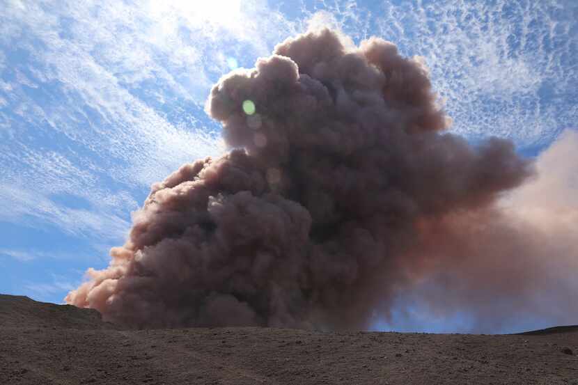 A plume of ash rises from Hawaii's Kilauea volcano after a magnitude 5.0 earthquake Thursday.