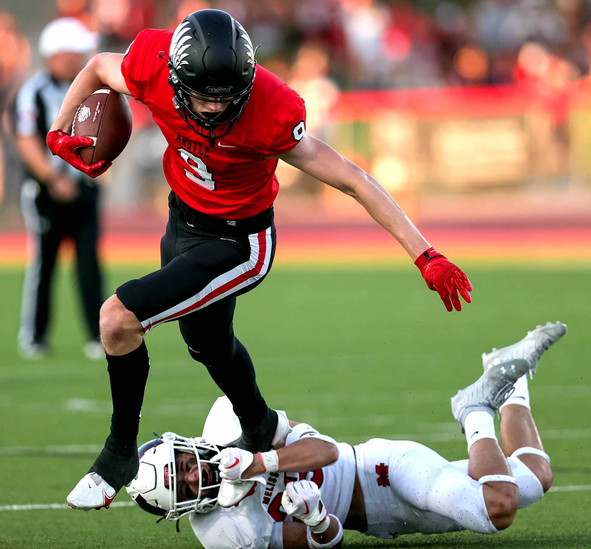 Argyle wide receiver Wayne Pritts (9) breaks a tackle from Melissa's Josh Nicholas (23) for...