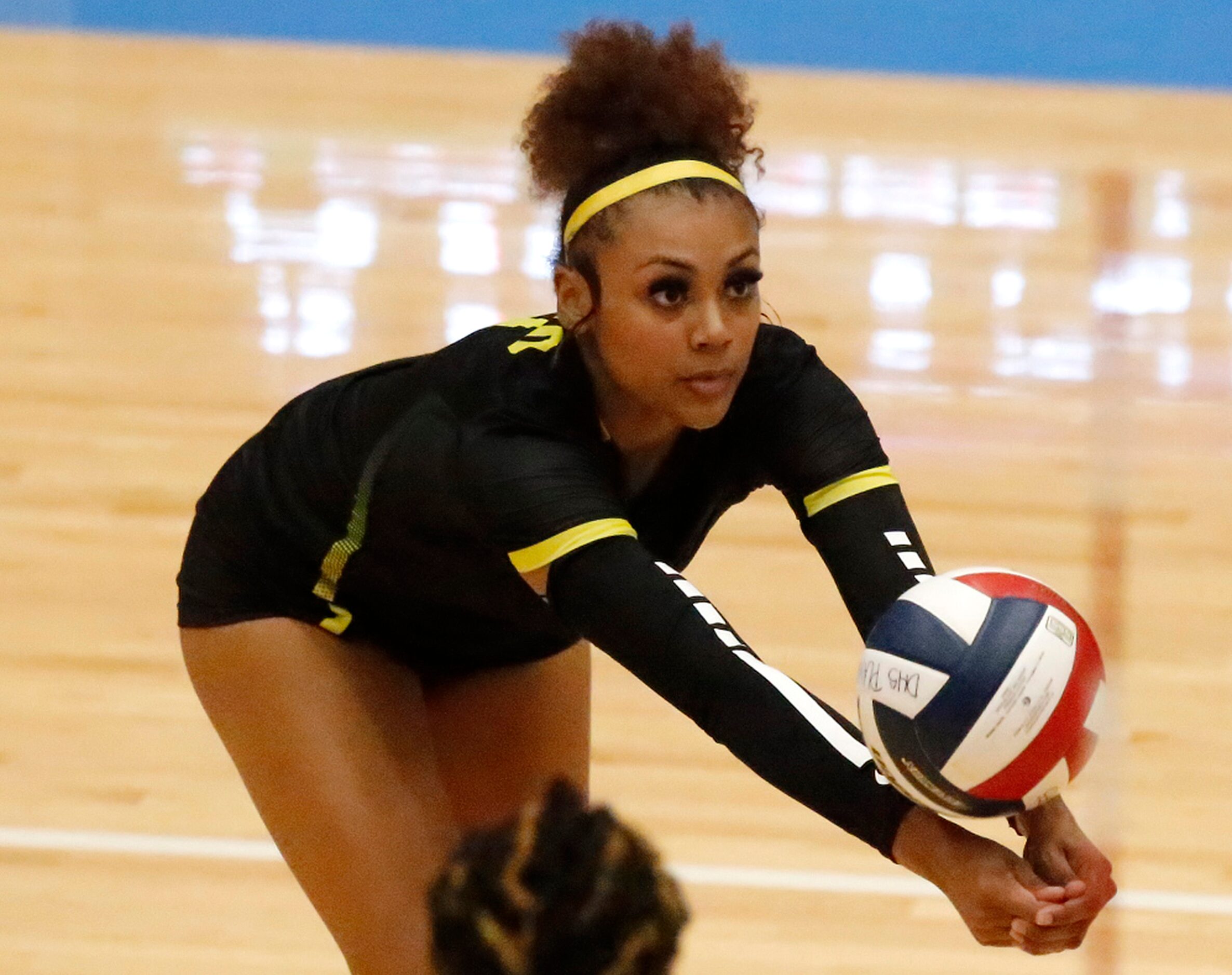 DeSoto High School outside hitter Haley Davenport (9) makes a save during game two as DeSoto...