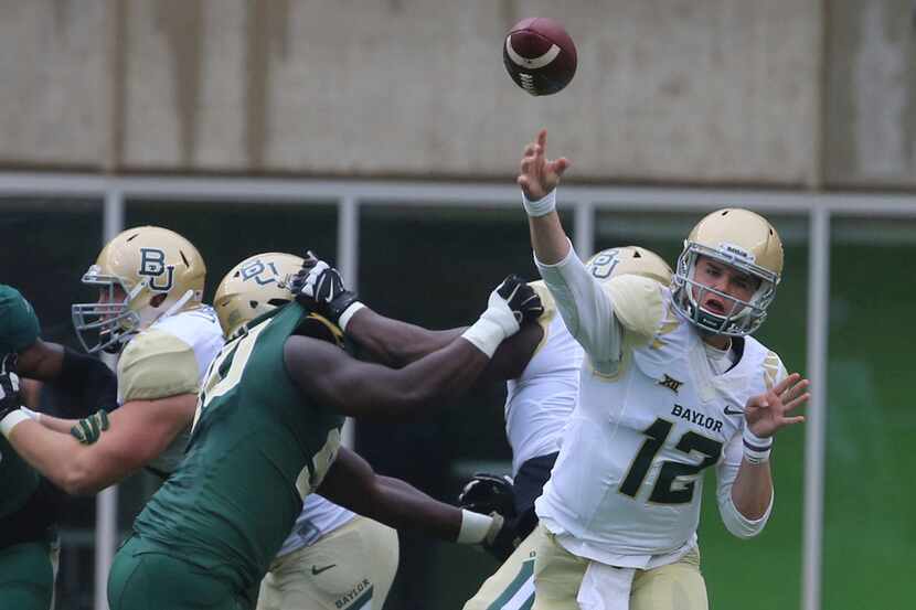 Baylor quarterback Charlie Brewer throws down field during their annual Green and Gold...