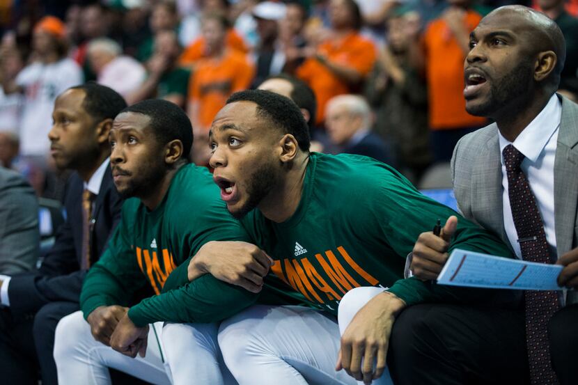 Miami (Fl) Hurricanes players watch from the bench during the second half of an NCAA men's...