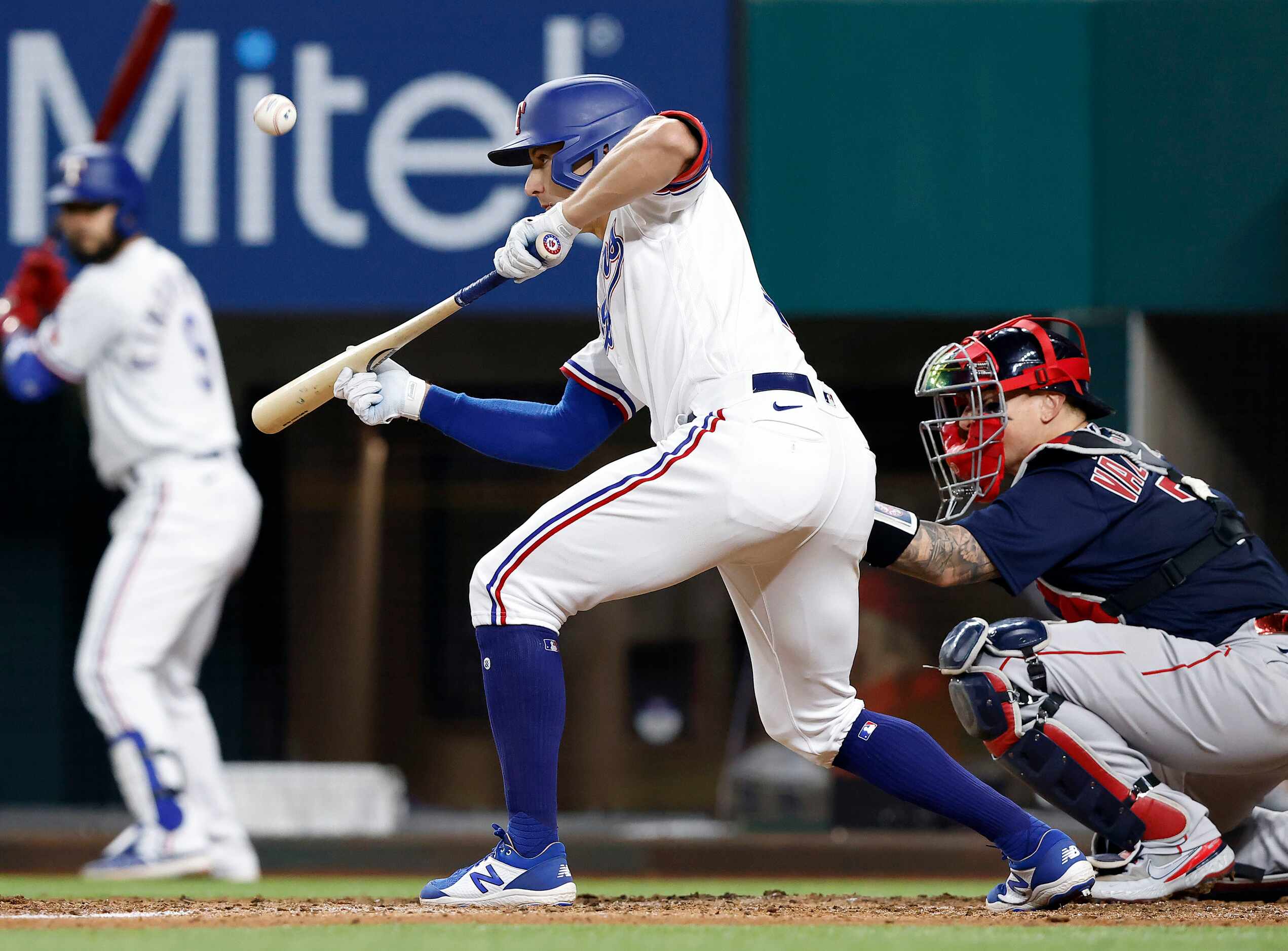 Texas Rangers batter Eli White (41) bunts to third but was caught by Boston Red Sox third...