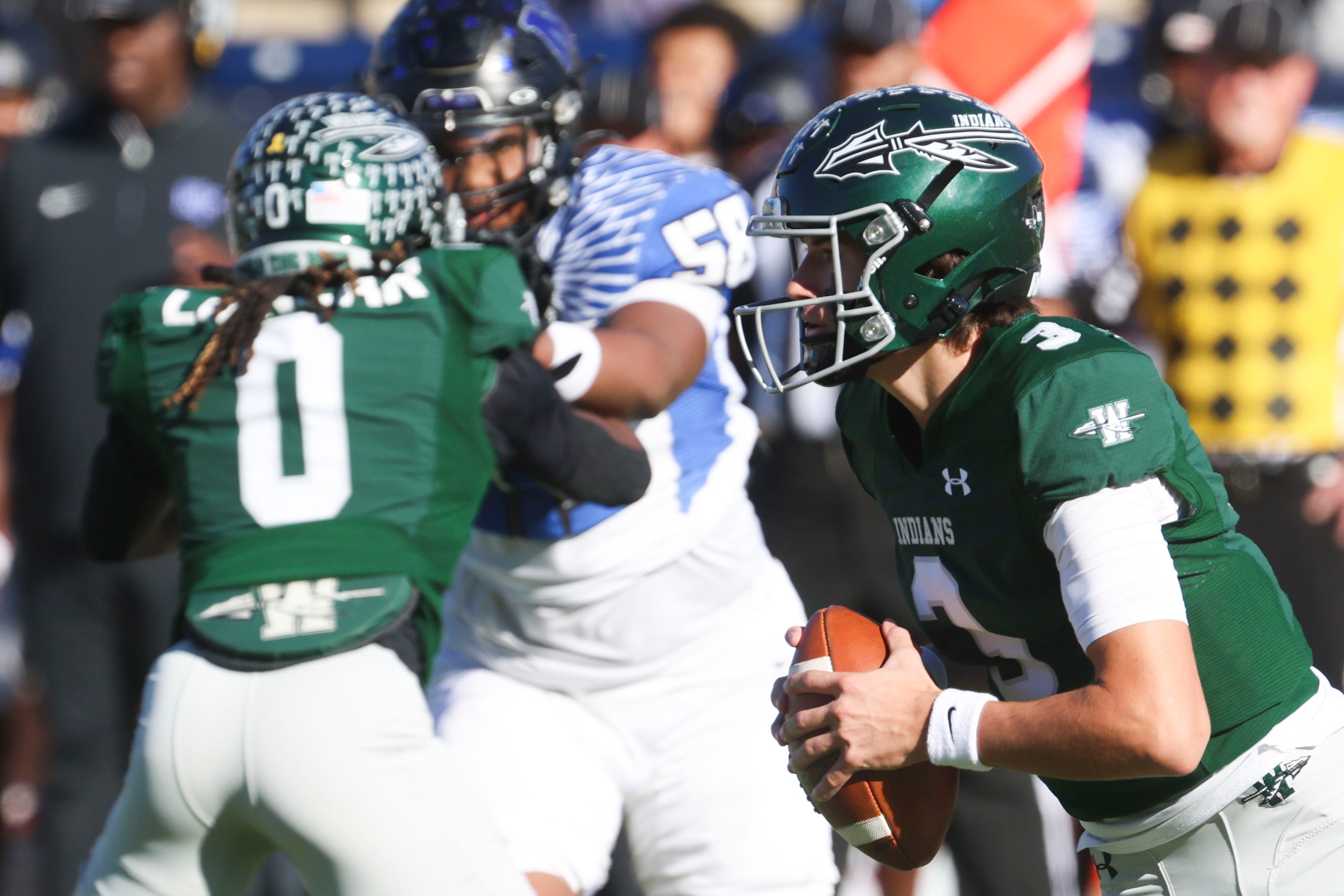 Waxahachie High’s QB Jerry Meyer III looks to throw the ball against North Forney High...