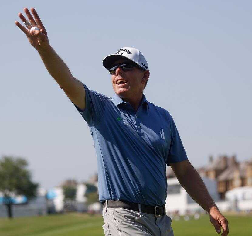 Justin Leonard waves toward the crowd after the 18th hole during the second round of AT&T...