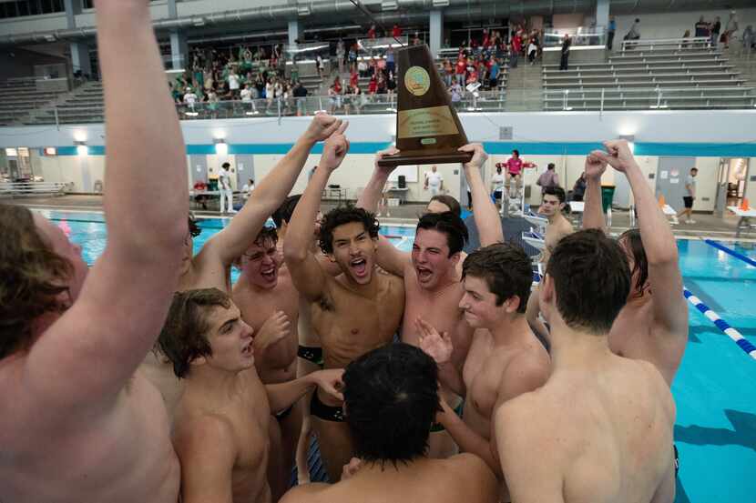 Southlake Carroll junior Chris Clarin (3) holds the 6A Region I boys water polo championship...