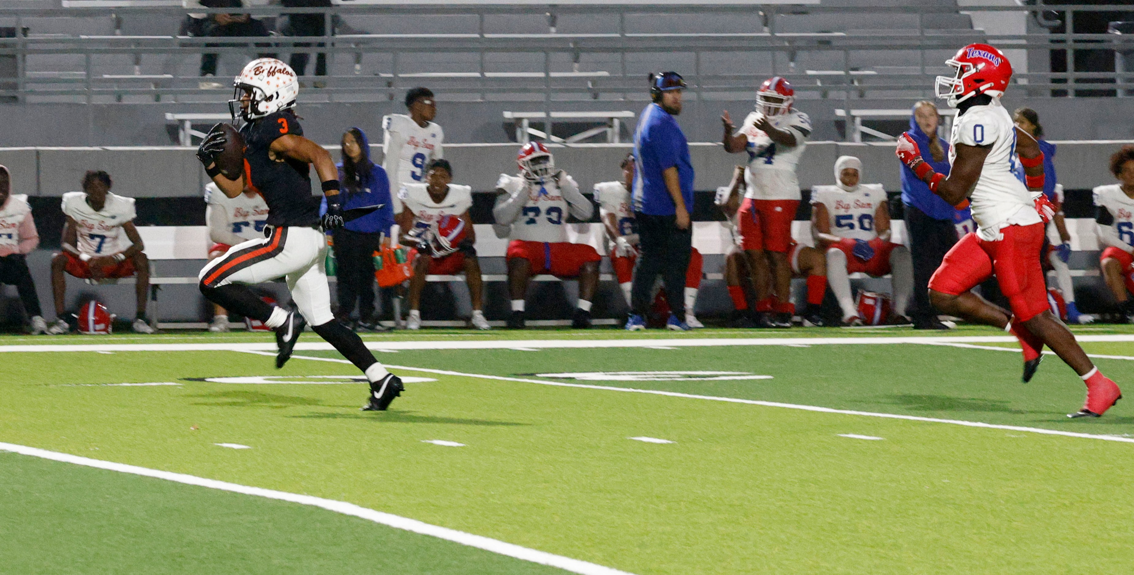 Haltom's Keenan Jackson (3) runs into the end zone for a touchdown as Sam Houston's Naftali...