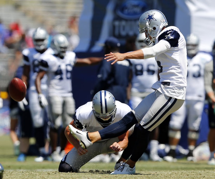 Dallas Cowboys kicker Dan Bailey (5) kicks a field goal during morning practice at training...