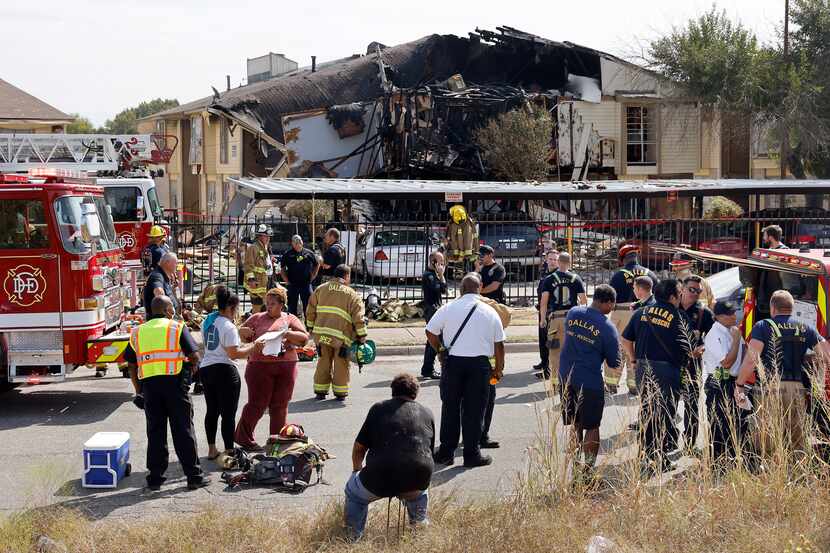 Dallas Fire-Rescue works the scene of an apartment explosion in the 5700 block of Highland...