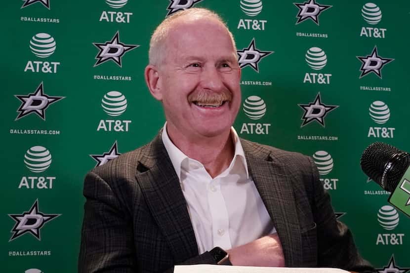 Dallas Stars manager Jim Nill smiles before speaking to reporters during a news conference...
