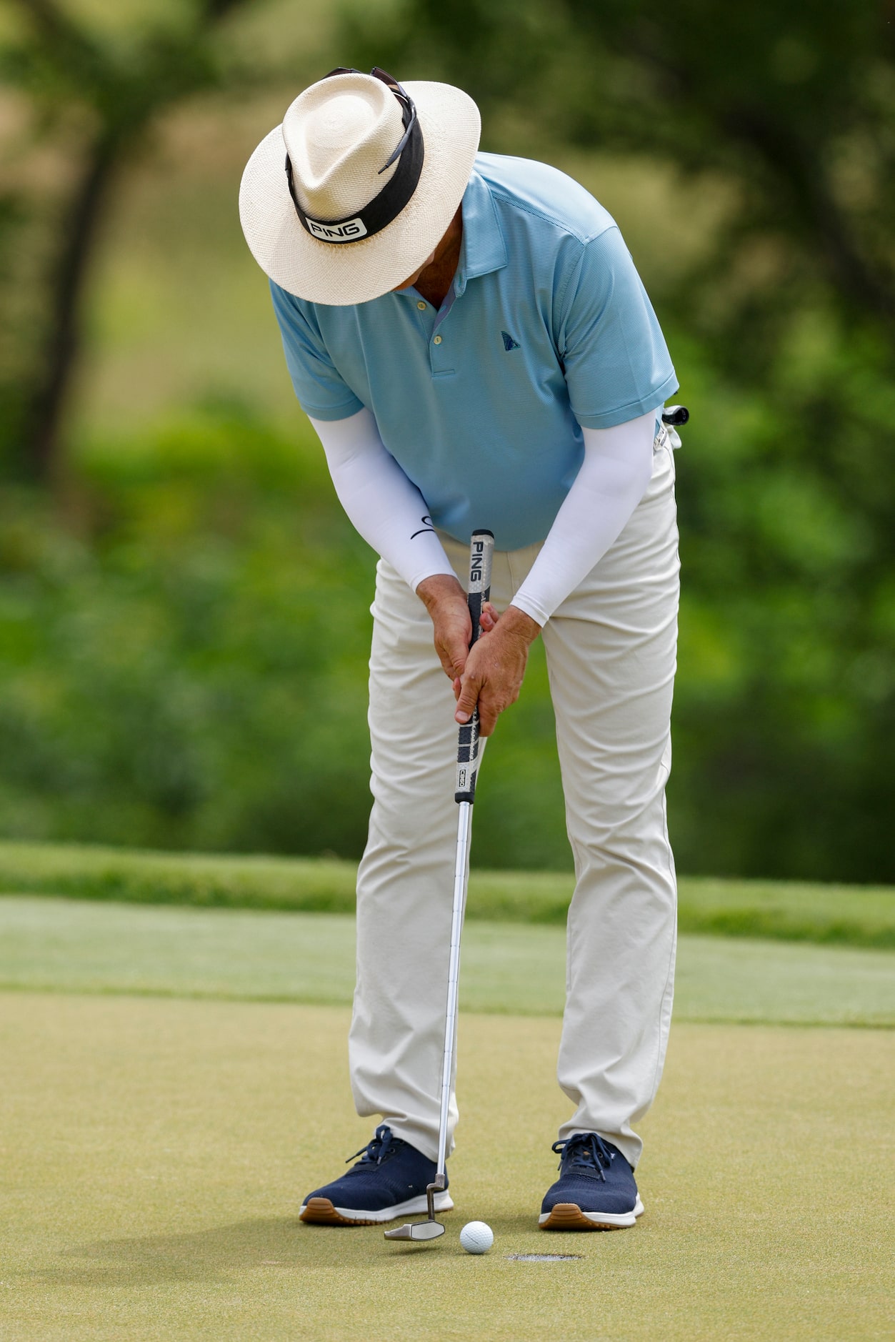 Preston Trail golf pro Cameron Doan sinks a birdie putt on the 18th green during the first...