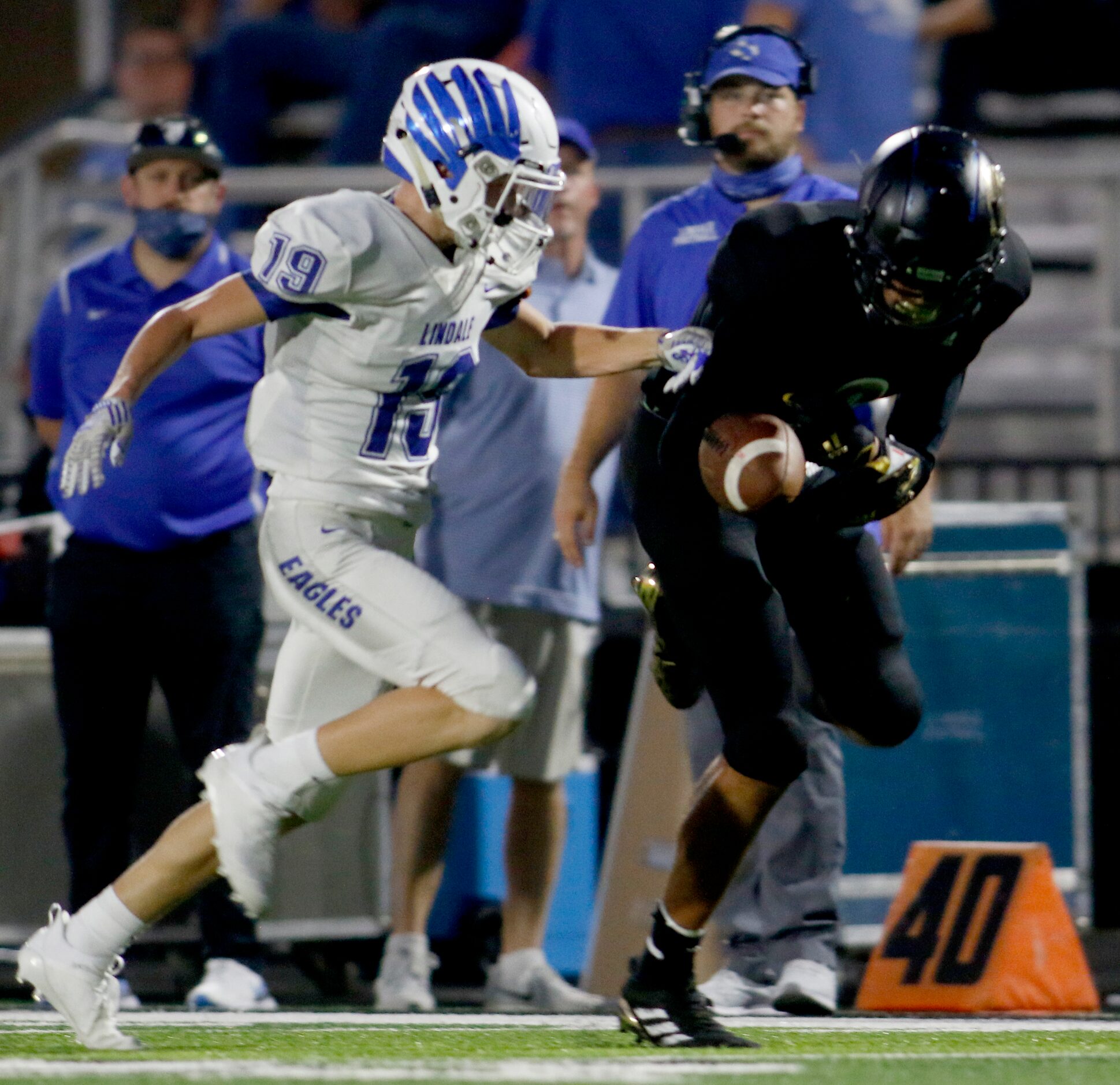 Kaufman receiver Daylon Dickerson (2) is unable to pull in a long pass as he is defended by...