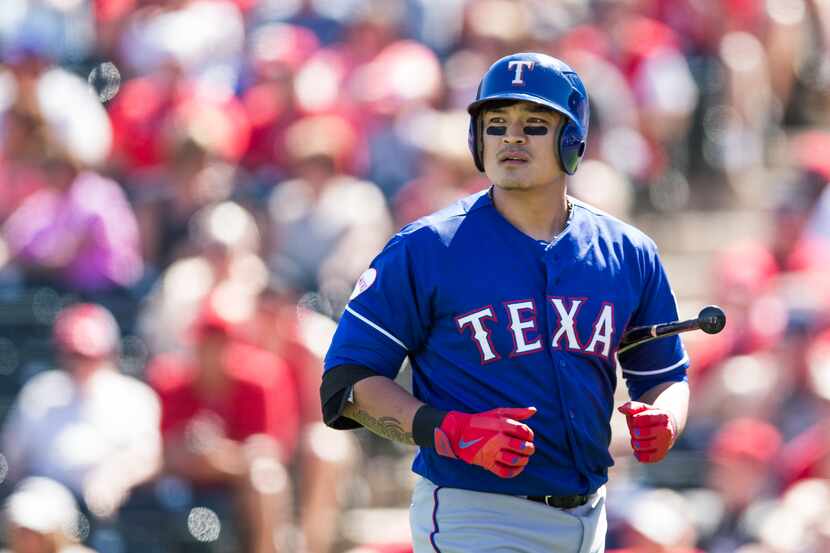 TEMPE, AZ - MARCH 10: Shin-Soo Choo #17 of the Texas Rangers looks on during a spring...