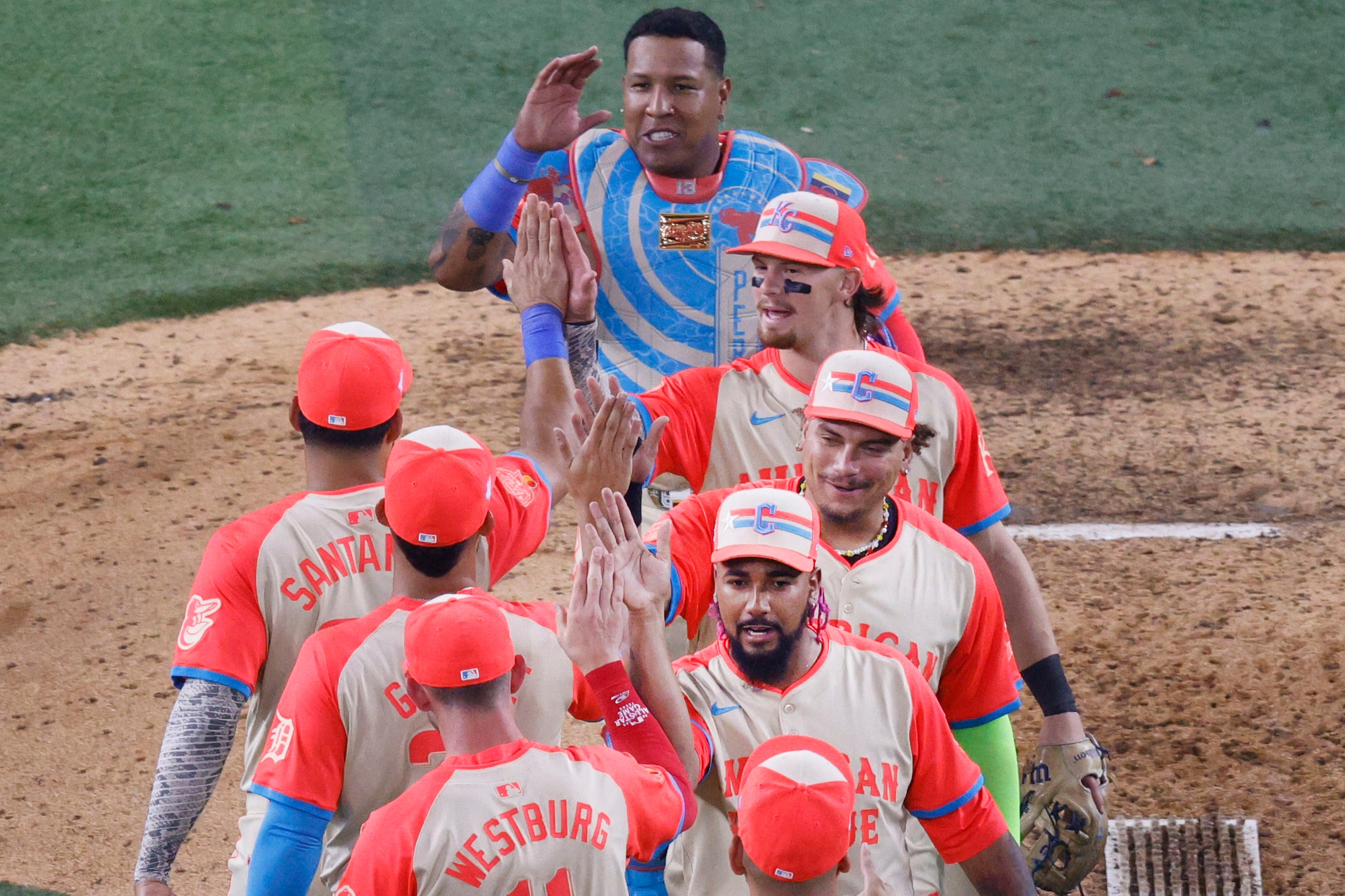 American League pitcher Emmanuel Clase of Cleveland Guardians (48), foreground right,...