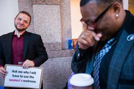 Trenton Johnson (right) jokes with Ethan Avanzino just after 7 a.m. as they stand in line to...