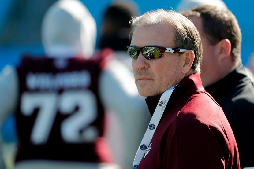 FILE - Texas A&M head coach Jimbo Fisher watches his team warm up before the Belk Bowl NCAA...