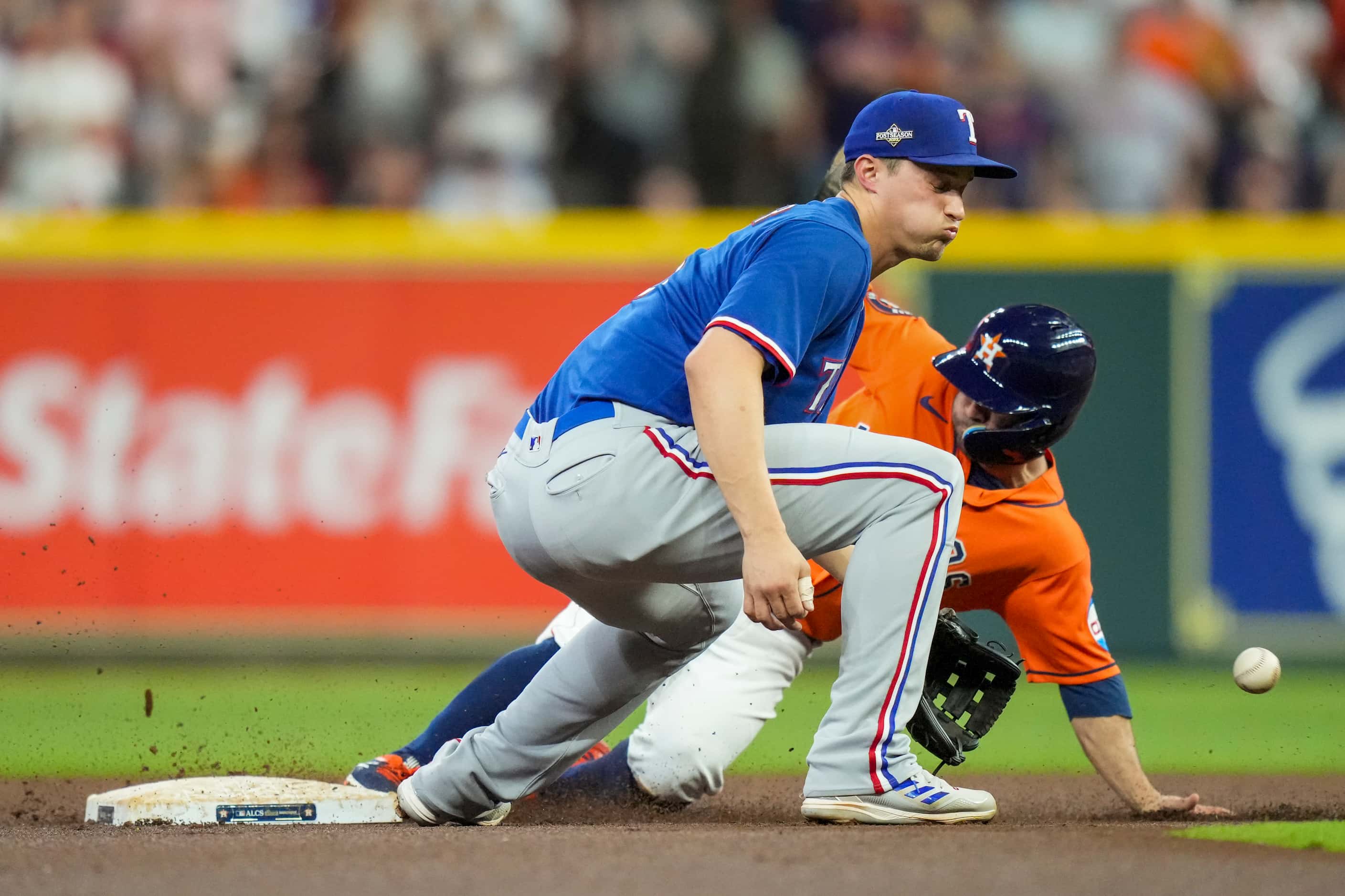 Houston Astros second baseman Jose Altuve steals second base as Texas Rangers shortstop...