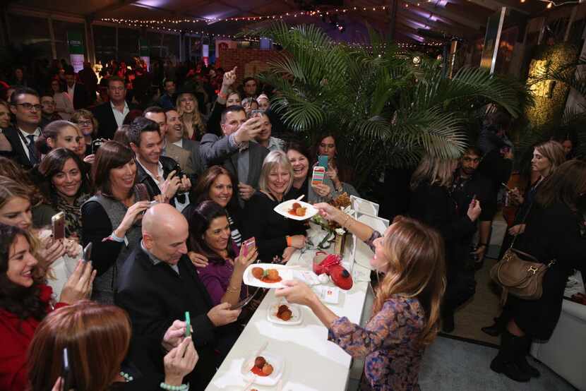 Chef Giada De Laurentis greets guests with food at Giada De Laurentiis' Italian Feast...