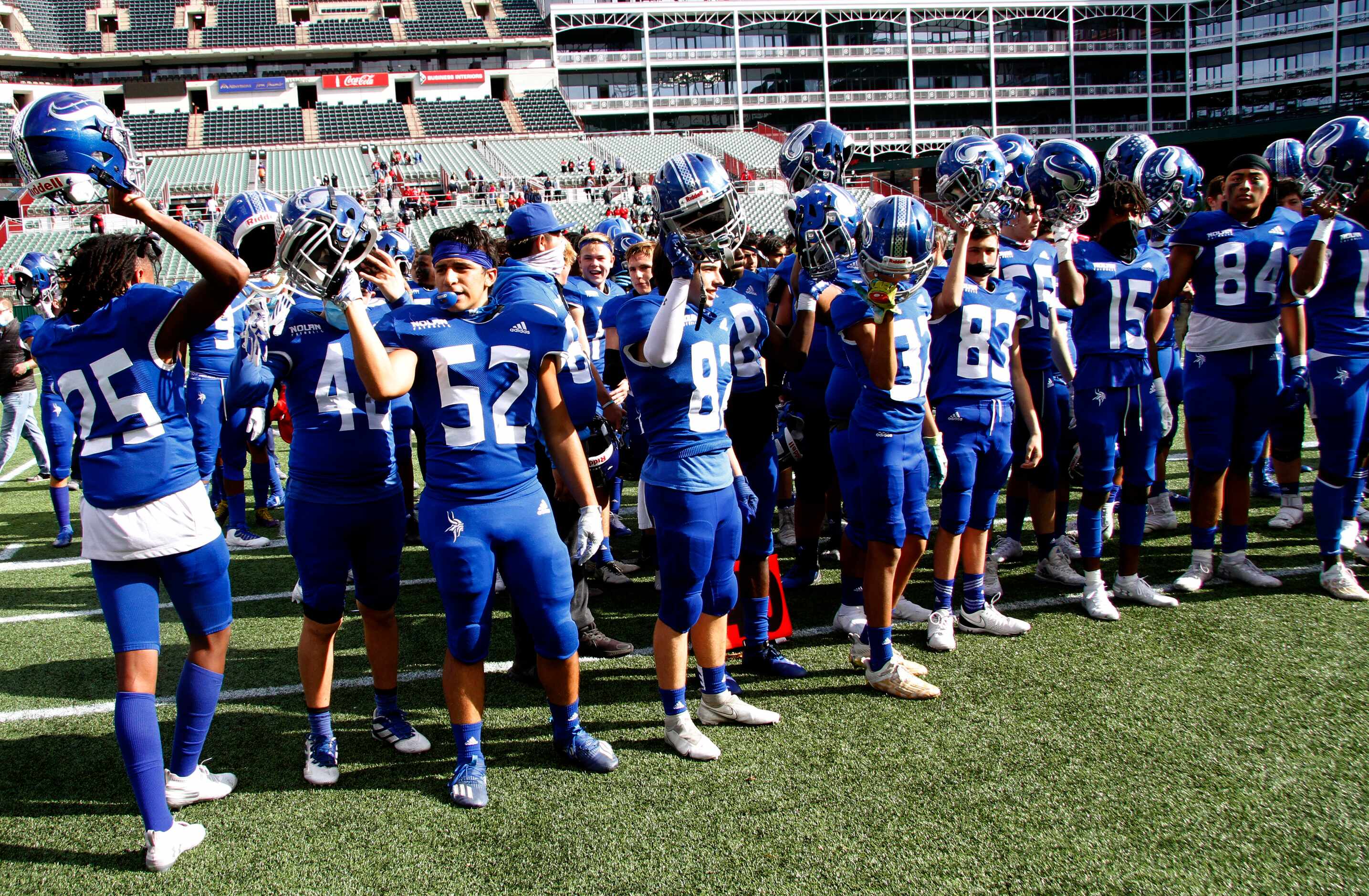 Fort Worth Nolan players assemble for the playing of their school song following their...