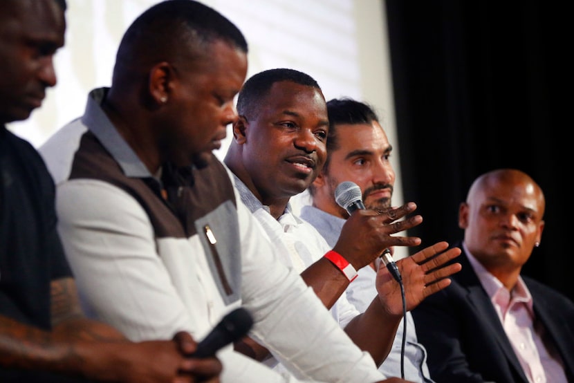 #8 Former Carter High football player Gary Edwards (center) speaks at the Dallas debut of an...