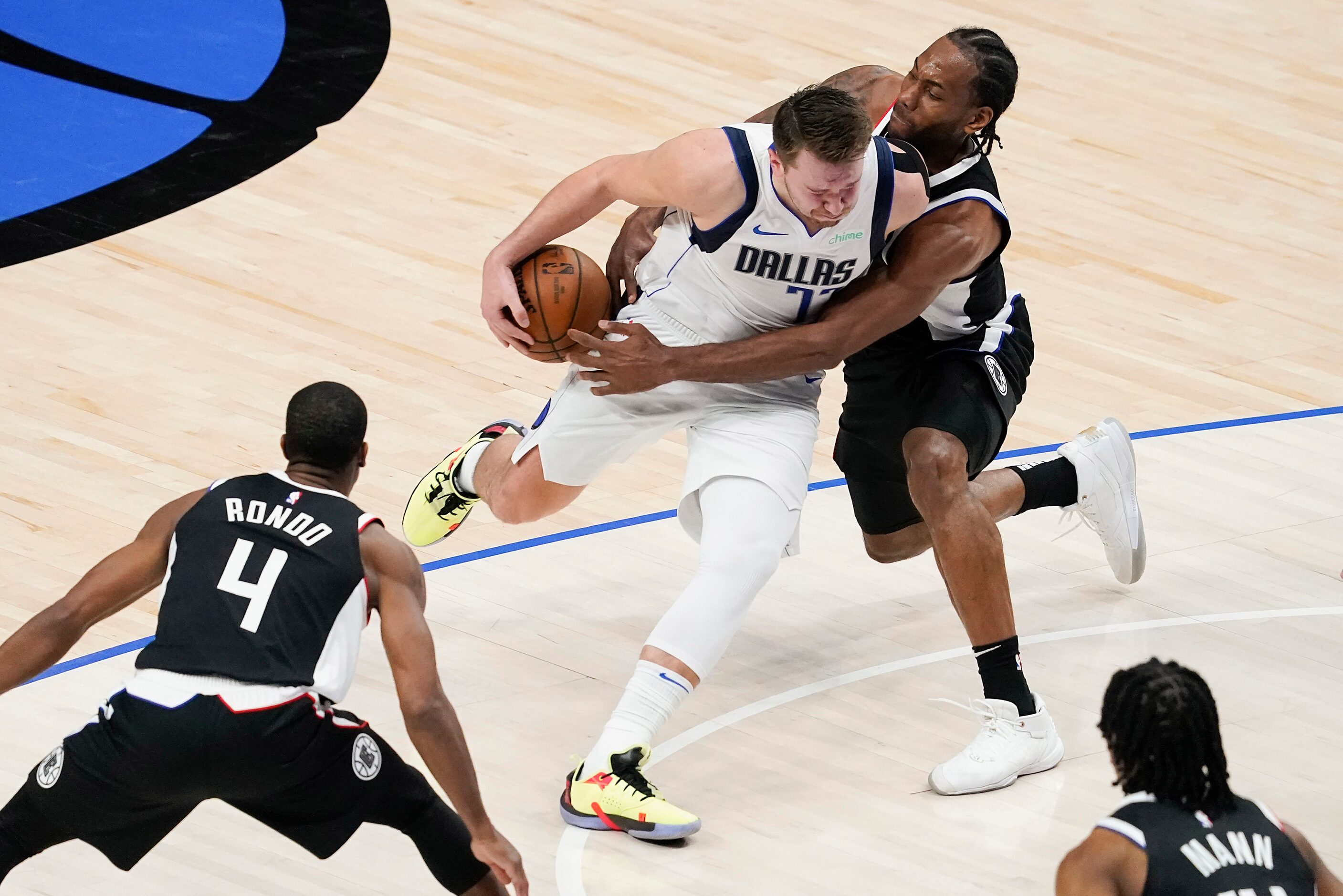 Dallas Mavericks guard Luka Doncic (77) has the ball knocked away by LA Clippers forward...