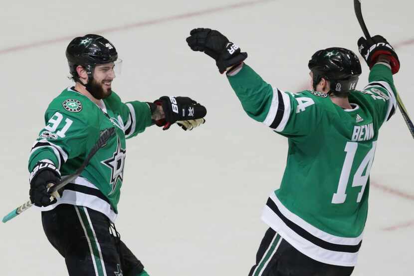 Dallas Stars center Tyler Seguin (91) celebrates his third goal of the game with teammate...