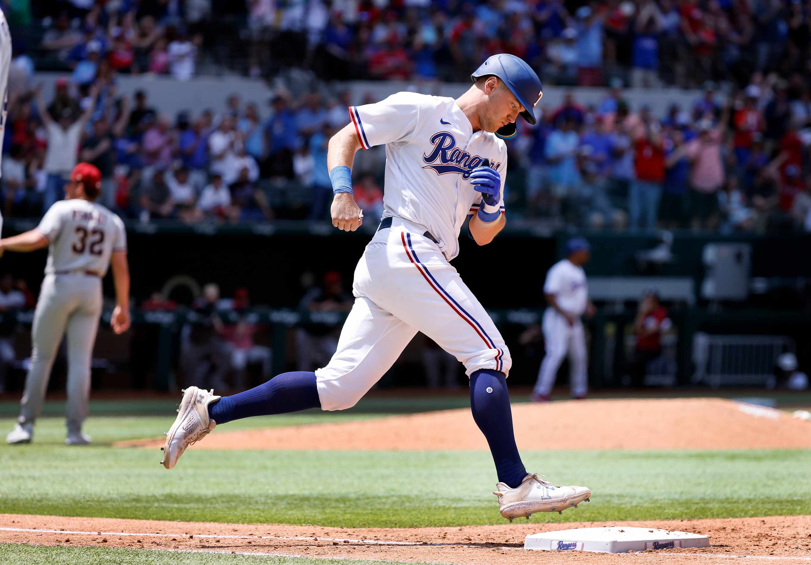 Texas Rangers third baseman Josh Jung (6) rounds first base after hitting a two-run homer...