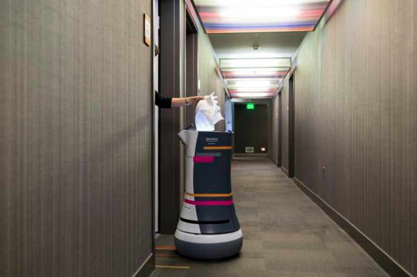 
Efficient if impersonal, a bellhop robot delivers an order of fresh towels to a guest’s...