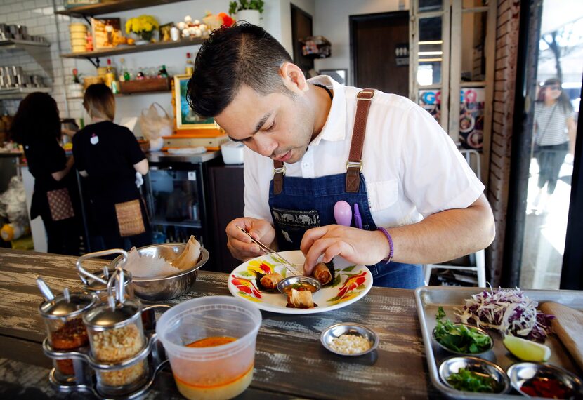 Chef and owner Donny Sirisavath prepares shrimp bites at his Khao Noodle Shop.