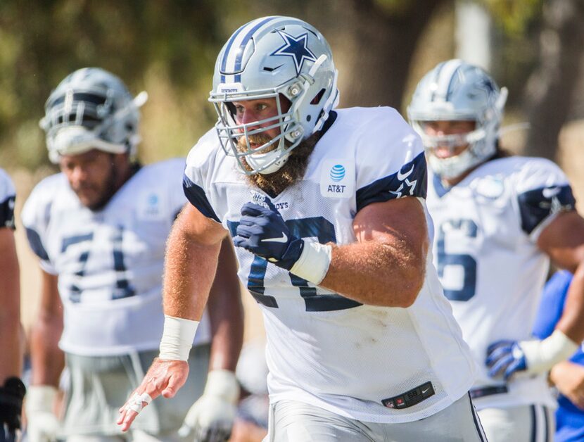 Dallas Cowboys center Travis Frederick (72) runs during an afternoon practice at training...