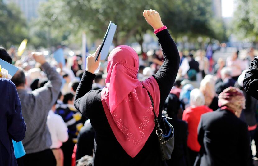 
Muslim participants cheered over protesters during a rally at the state Capitol in Austin...