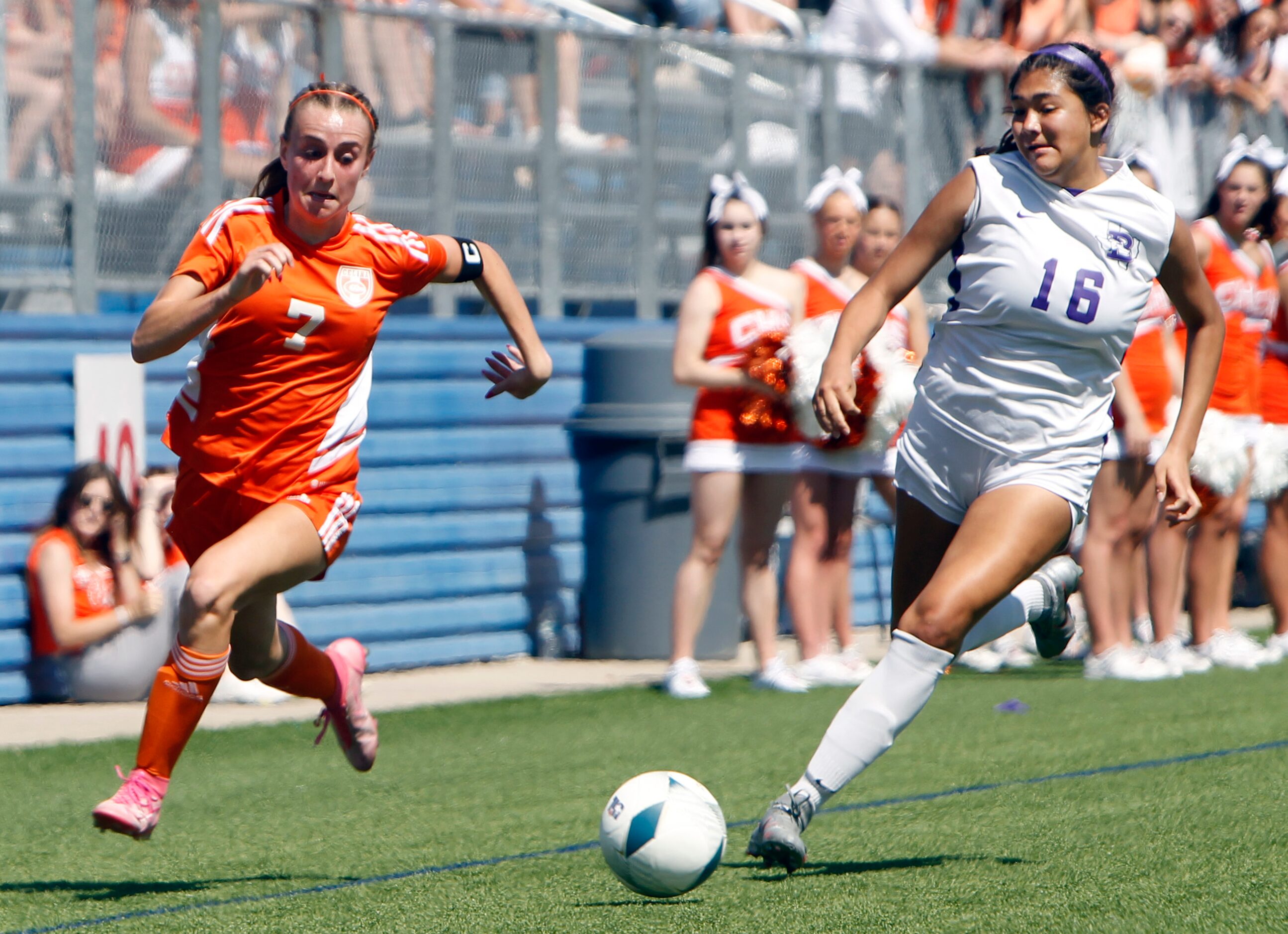 Celina's Lexi Tuite (7) bolts to the ball as she is challenged by Boerne's Kassie Lozano...