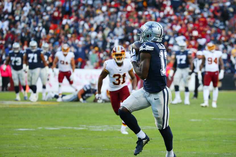 Dallas Cowboys wide receiver Michael Gallup (13) catches a pass before running to make a...