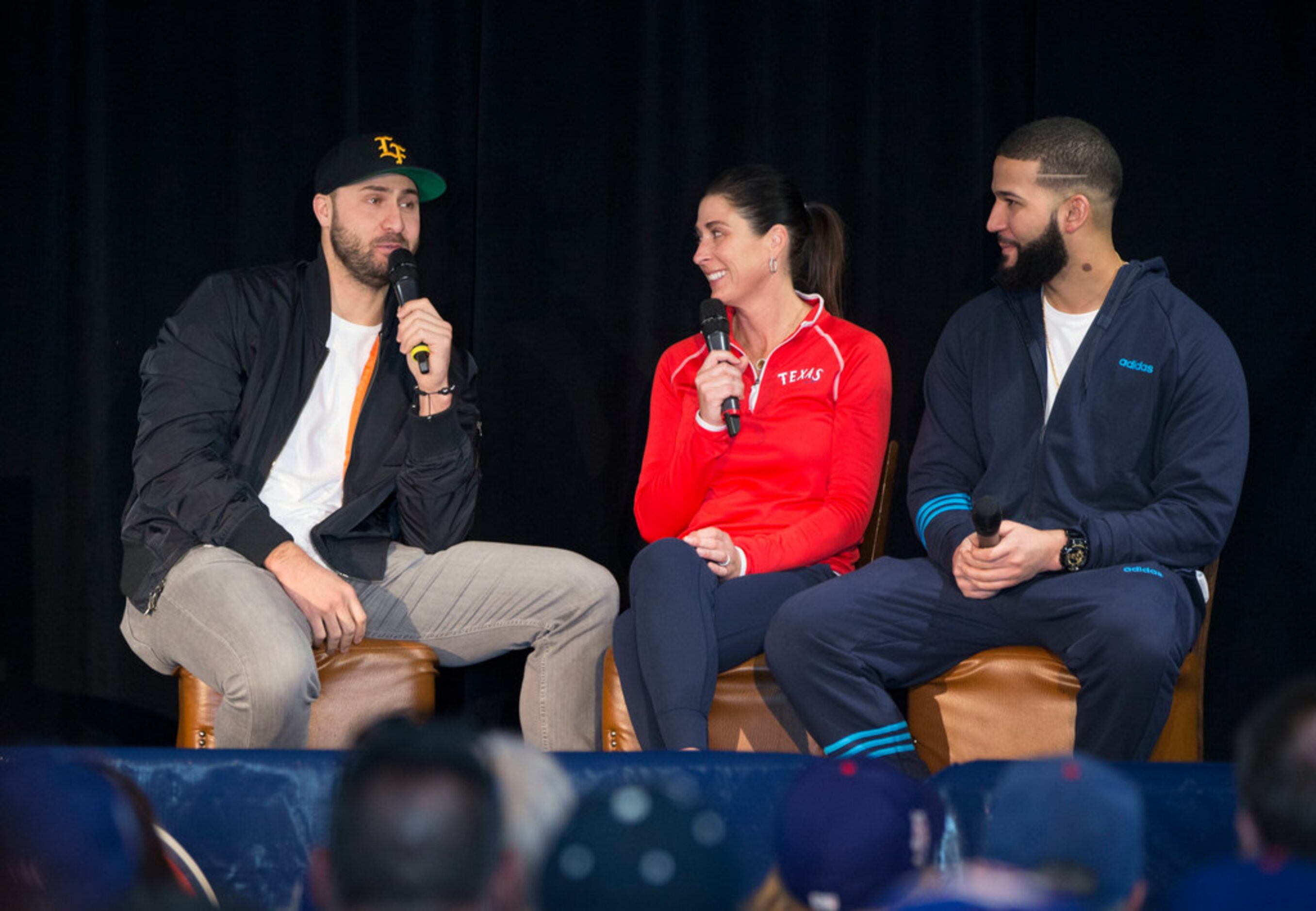 Texas Rangers Joey Gallo, left, and Nomar Mazara, right, talk with sideline reporter Emily...