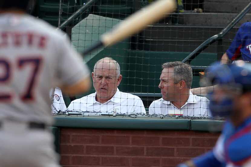 Texas Rangers CEO Nolan Ryan and Houston Astros President Reid Ryan in the first inning of...