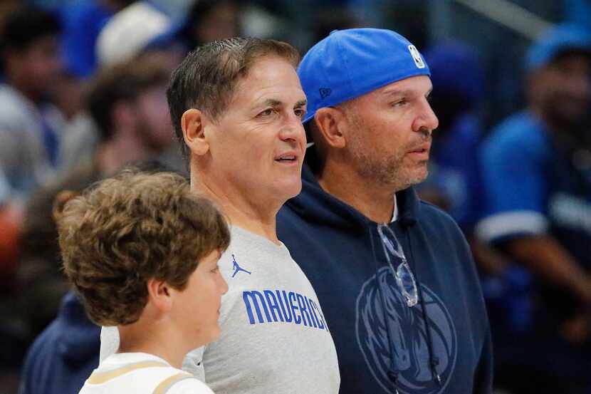 Mavricks owner Mark Cuban meets with head coach Jason Kidd after the game at the Mavs Fan...