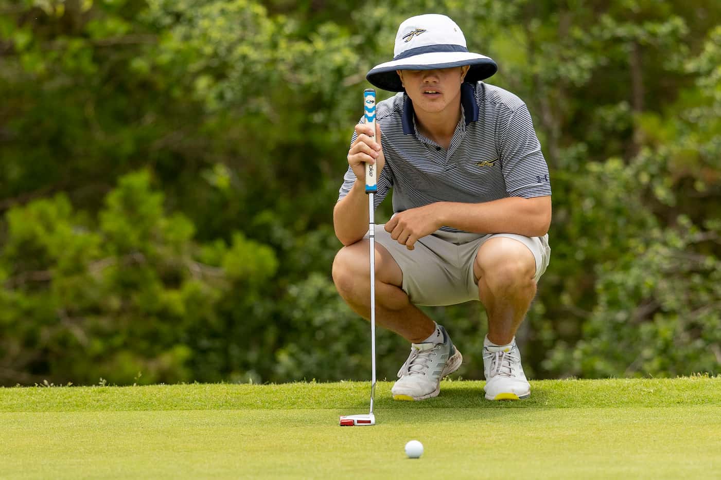 KellerÕs Kaelen Dulany studies his shot on the 14th green during the final round of the UIL...
